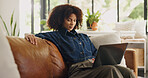 Laptop, remote work and black woman on sofa in home for editing, story review and feedback. Freelance, hybrid worker and person on couch with computer for digital submission, copywriting and planning