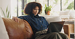 Laptop, home and black woman on sofa for online editing, story review and freelance career. House, remote worker and person on couch with computer for digital submission, copywriting and planning