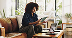 Tablet, remote work and black woman on sofa for online editing, story review and research in home. Freelance, hybrid worker and person on couch on tech for digital submission, copywriting or planning