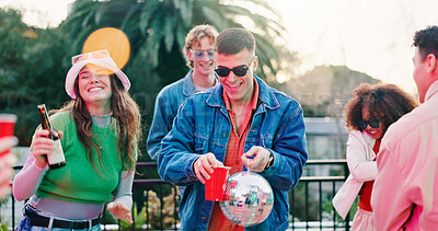 Buy stock photo Dance, disco ball and drink with friends outdoor together for celebration, fun or social gathering. Alcohol, party and reunion with group of people in backyard of home for energy, holiday or weekend