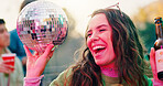Friends, alcohol and happy woman with disco ball at party, social event and get together for reunion. Excited, beer and person with group for weekend bonding, outdoor rave and summer festival fun
