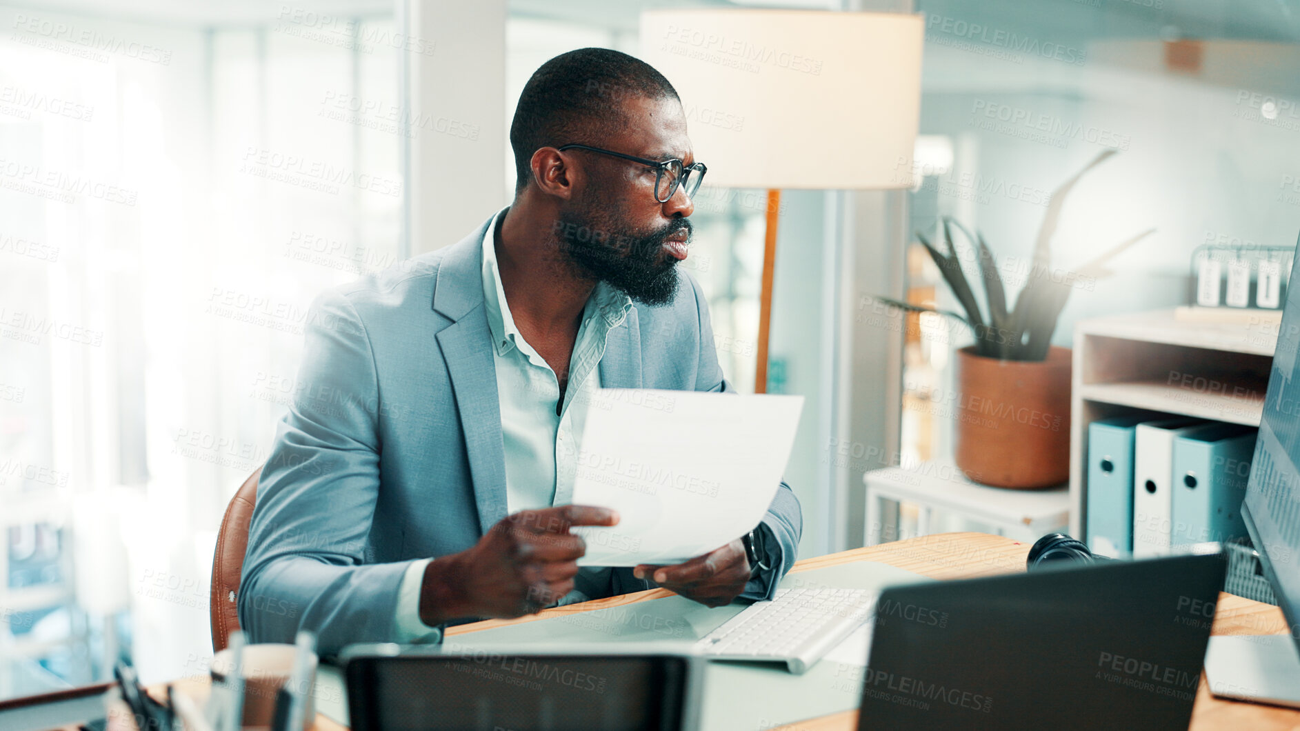 Buy stock photo Black man, documents and confused with computer at office with glasses, review or flare at investment company. African person, broker and doubt for glitch, mistake or administration at finance agency