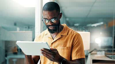 Buy stock photo Creative, office and business black man on tablet for online editing, publication and news article. Publishing, magazine agency and person on digital tech for proofreading, research and story review