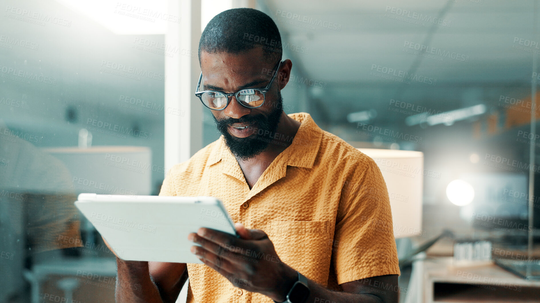 Buy stock photo Creative, office and business black man on tablet for online editing, publication and news article. Publishing, magazine agency and person on digital tech for proofreading, research and story review