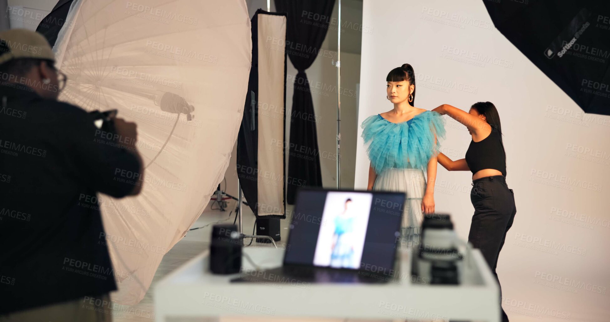 Buy stock photo Preparation, photoshoot and people on set with stylist, getting ready and clothing option in studio. Collaboration,  model or film team with planning, fashion catalog or backstage in media production