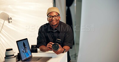 Buy stock photo Portrait, photographer and man in studio with camera, laptop and creative insight for media project. Space, black person and smile on set with photography equipment, computer and film production.
