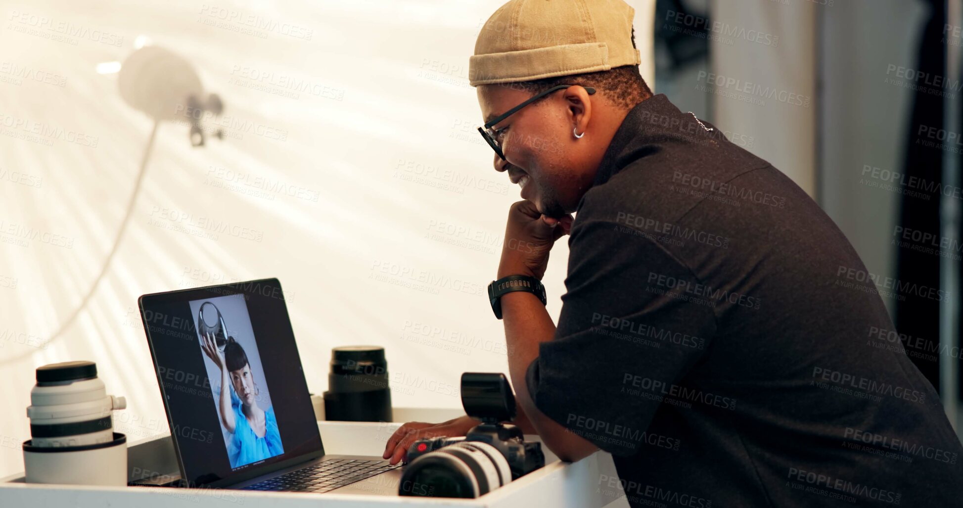 Buy stock photo Photographer, thinking or laptop with screen in studio for catalog results, editing or planning. Cameraman, black man or creative idea with tech BTS for photo review, retouch image or post production
