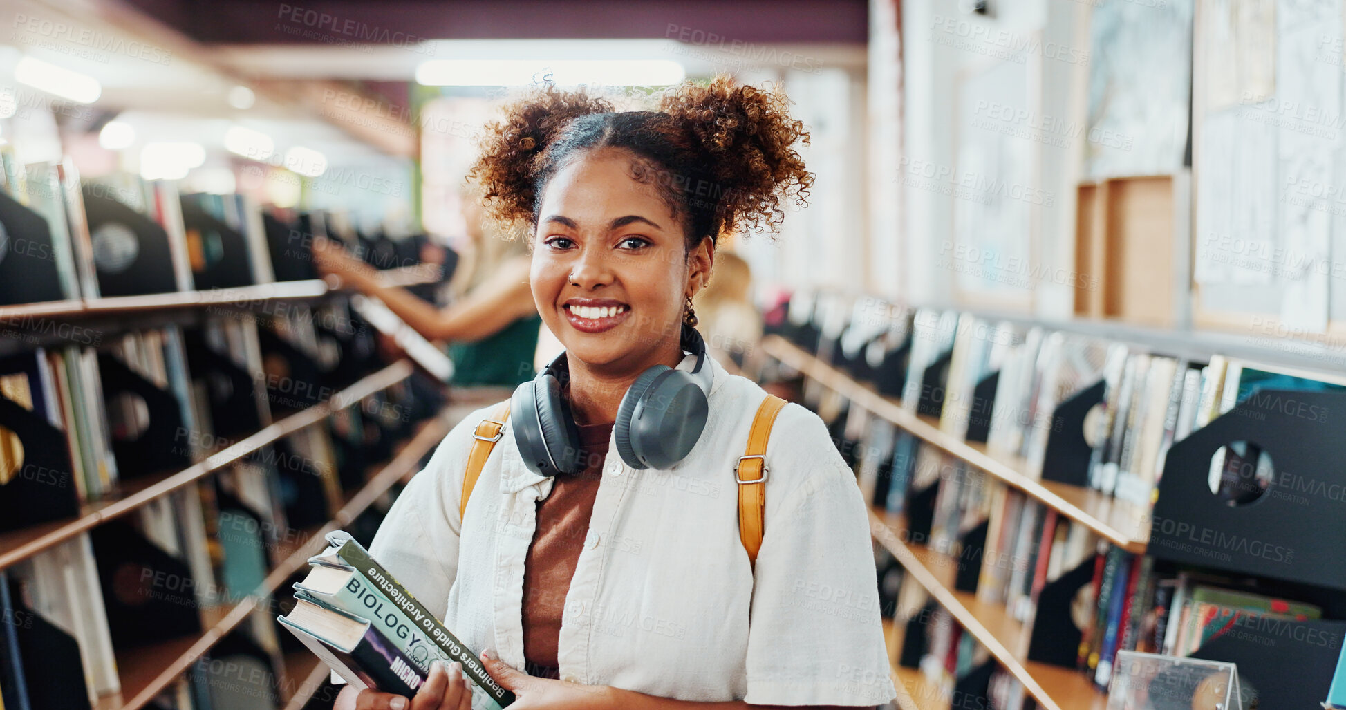 Buy stock photo Woman, college student and smile with books at library for research project, studying and confident at campus. Girl, happy and learning with literature, portrait or pride for education at university