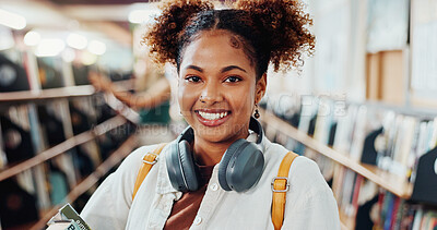 Buy stock photo Girl, college student and smile with headphones in library for education, books and portrait at campus. Woman, happy and confidence for scholarship, learning and backpack for studying at university