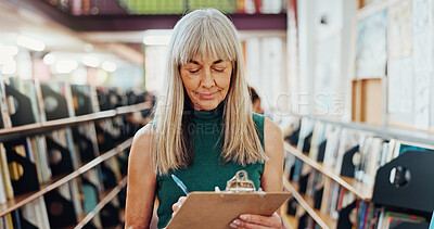 Buy stock photo Library, writing and mature woman with inspection for stock control, material checklist and info. Admin, librarian and clipboard in bookstore for inventory notes, sampling books and resource catalog