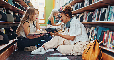 Buy stock photo Tablet, women and students in library, funny and ideas for academic project, education and college. University, friends or people on floor, discussion or tech for online course, research or knowledge
