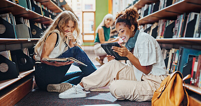 Buy stock photo Tablet, friends and students in library, talking and ideas for academic project, smile and college. University, laughing or women on floor, conversation or tech for online course, joke or education