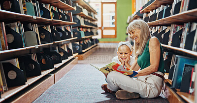 Buy stock photo Grandmother, reading book and girl in library, smile and bonding together for child development. Senior woman, kid or family on floor, happiness and support for education, literacy, hobby or teaching