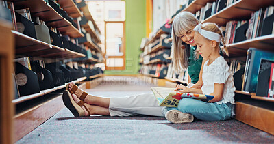 Buy stock photo Grandmother, reading book and girl in library, relax or bonding together for storytelling. Senior woman, happy child or family on floor, fantasy or support for education, literacy or mind development