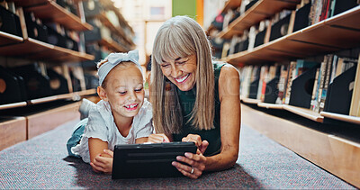 Buy stock photo Child, tablet and grandmother in library with ebook, bonding and reading literature for development. Happy, grandparent and girl grandchild with tech for kids storytelling app, learning or knowledge.