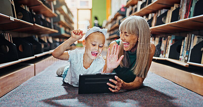 Buy stock photo Fist pump, library and tablet with student and teacher on floor together for learning or reading. Celebration, development and success with woman teaching excited girl child in school for growth