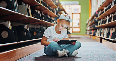 Buy stock photo Girl, child and reading in library with tablet, ebook website and online literature for development. Kid, scroll and browsing at school with tech, storytelling app and education for knowledge growth.
