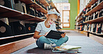 Girl, kid and reading in library with tablet, ebook website and online literature for development. Child, smile and scroll at school with tech, storytelling app and education for knowledge growth.