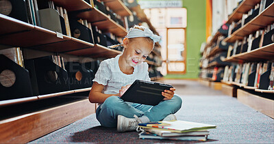 Buy stock photo Girl, kid and reading in library with tablet, ebook website and online literature for development. Child, smile and scroll at school with tech, storytelling app and education for knowledge growth.