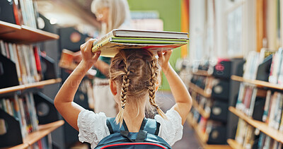Buy stock photo Back, balance and books with girl in library for child development, literature or study. Education, learning and reading assignment with student at school for future, information or knowledge