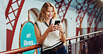 Woman, college student and texting with phone at library for education, smile or contact at campus. Girl, smartphone and happy for web chat, mobile app and social media on study break at university