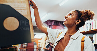 Buy stock photo Student, girl and search on bookshelf at college for book choice, exam preparation and knowledge. University, african person and check course resources in library for research, decision and learning