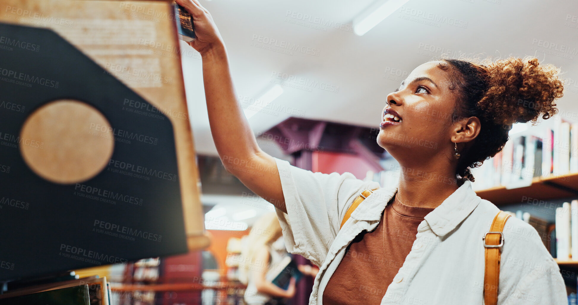 Buy stock photo Student, girl and search on bookshelf at college for book choice, exam preparation and knowledge. University, african person and check course resources in library for research, decision and learning