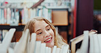 Student, girl and search on bookshelf at university for book choice, pick textbook or knowledge. Campus, happy person or check course resources in library for study research, thesis citation or above