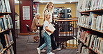 Education, mother and walking with daughter in library for child development, literature or reading. Books, learning and student girl with woman parent in school for future, growth or study