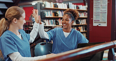Buy stock photo Women, medical students and high five with smile at library for research, planning and education at campus. Girl, healthcare scholarship and celebration with goals, learning and laptop at university