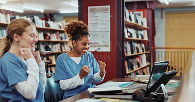 Buy stock photo Women, medical students and celebration with laptop at library for research, success and education at campus. Girl, healthcare scholarship and achievement with goals, fist pump or smile at university