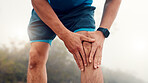 Man, hands and fitness with knee injury for workout accident, sprain or pressure in nature. Active, male person or runner with sore leg, joint inflammation or muscle tension for exercise or training