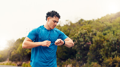 Buy stock photo Runner, smart watch and check with man in nature for fitness tracker, performance app and health stats. Running progress, online training schedule and wellness with person outdoor for stopwatch timer