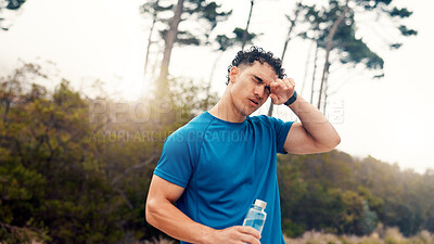 Buy stock photo Tired, water and fitness with man in nature for workout fatigue, running performance and health. Intense exercise, sweating and training break with person outdoor for cardio, challenge and exhausted