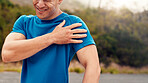 Fitness, hands and man with shoulder pain in nature for workout accident, repetitive strain or ache. Injury, athlete and muscle tension outdoor for exercise mistake, joint inflammation and discomfort