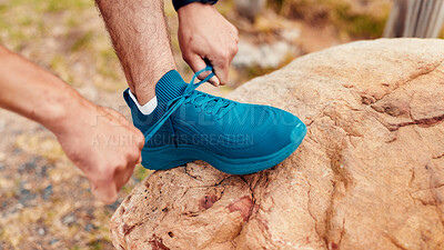 Buy stock photo Shoelace, hands and man with fitness, hiking for health benefits and workout preparation in forest. Rock, hiker and person in woods, adventure and sneakers for trekking safety, exercise and wellness