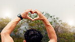 Hiking, heart hands and man in forest, back and fitness for wellness, workout progress and sign. Hiker, nature and person in woods, exercise and symbol for cardio health and love emoji for training