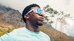 Thinking, nature and black man with exercise, sunglasses for uv protection and challenge. Decision, reflection and person with eyewear, polarized lenses and fitness for health benefits and low angle