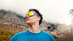 Thinking, outdoor and man with fitness, sunglasses for uv protection or contemplation. Low angle, reflection or person with shield eyewear, polarized lenses or workout for health benefits or exercise