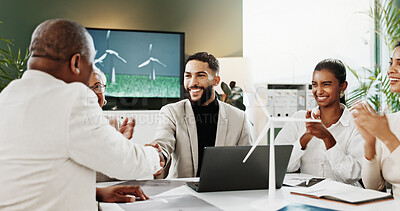 Buy stock photo Laptop, handshake or people with wind turbine for applause, clean energy deal or eco friendly partnership. Smile, office, team clap with sustainability agreement for green policy, shaking hands or pc