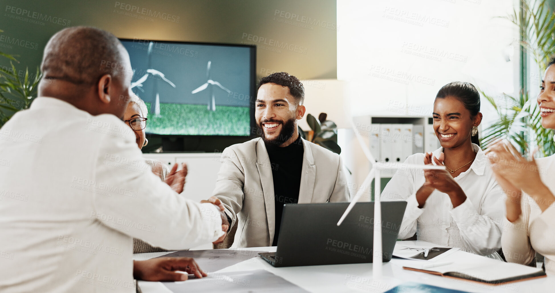 Buy stock photo Laptop, handshake or people with wind turbine for applause, clean energy deal or eco friendly partnership. Smile, office, team clap with sustainability agreement for green policy, shaking hands or pc