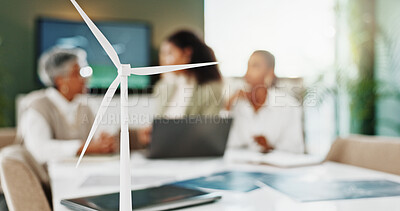 Buy stock photo Model, sustainability and wind turbine with business people in boardroom for technology development. Conservation, engineering and renewable energy with team in workplace for environmental future