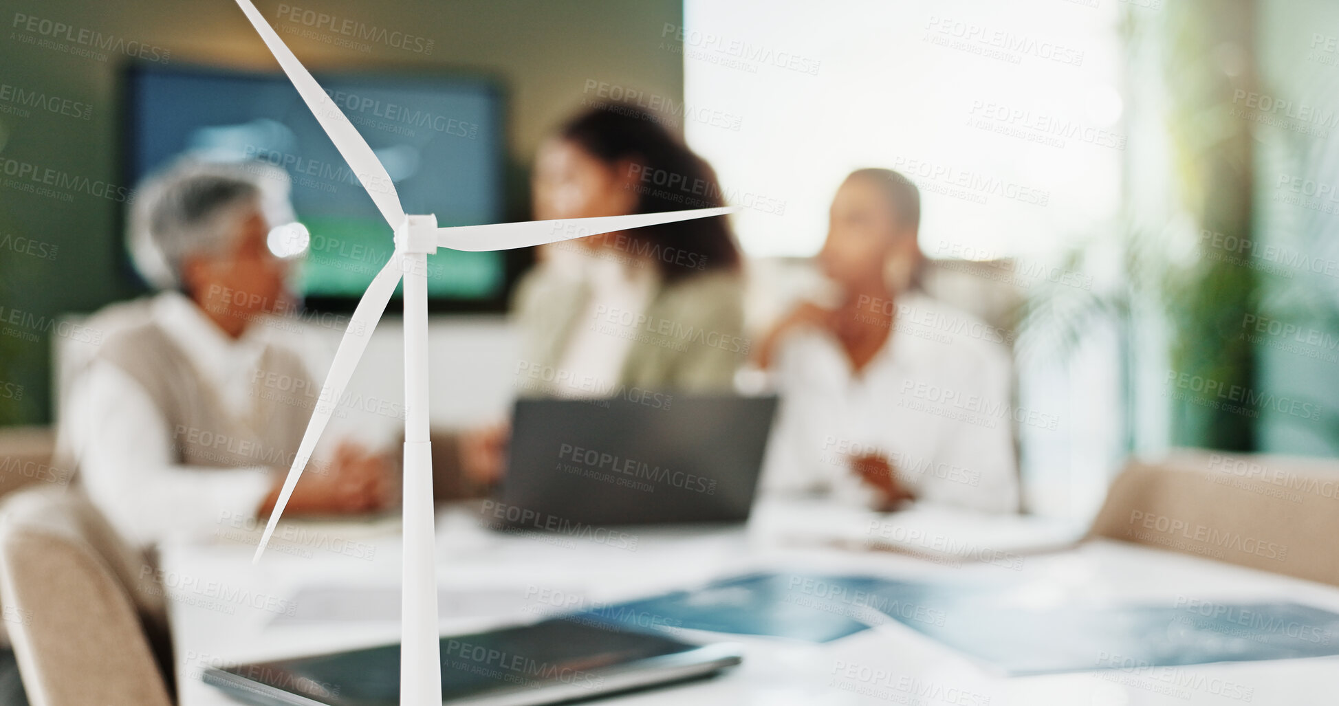 Buy stock photo Model, sustainability and wind turbine with business people in boardroom for technology development. Conservation, engineering and renewable energy with team in workplace for environmental future