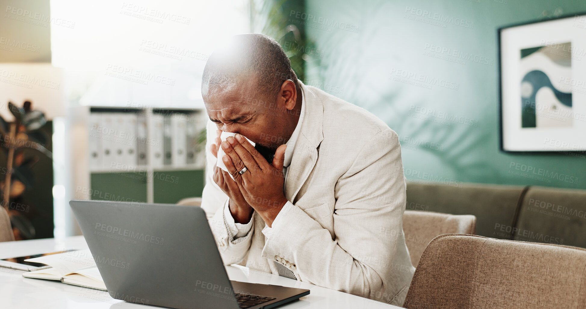Buy stock photo Sick man, laptop or blowing nose with tissue in office for influenza, sinus or allergy. Sneeze, African businessman and hayfever with virus or infection on computer for bacteria or germs in workplace