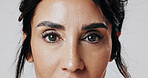 Portrait, woman and eyes with makeup in studio for beauty, laminated eyebrows and natural glow. Closeup, mature person or cosmetics with lash extension, facial treatment and shine on white background