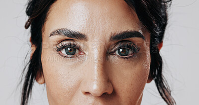 Buy stock photo Portrait, woman and eyes with makeup in studio for beauty, laminated eyebrows and natural glow. Closeup, mature person or cosmetics with lash extension, facial treatment and shine on white background