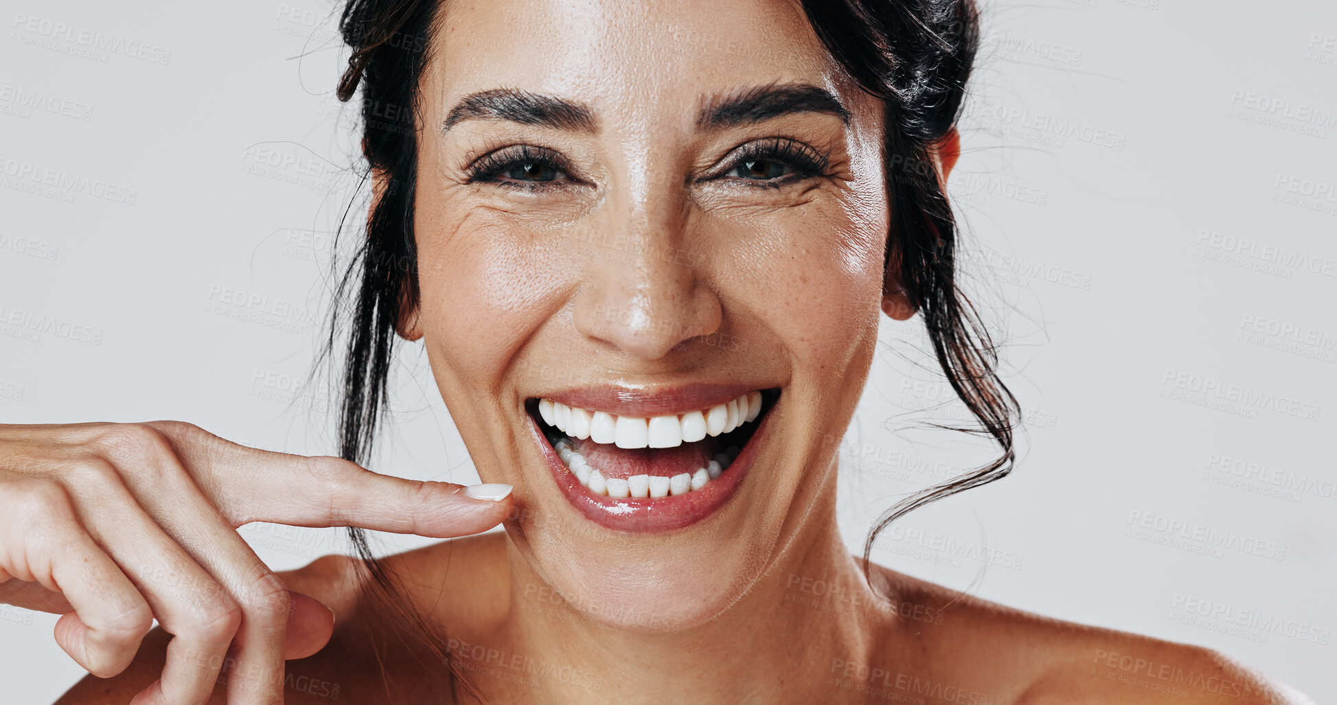 Buy stock photo Beauty, finger and portrait with happy woman in studio for antiaging cosmetics or dermatology results. Aesthetic, skincare ad smile of mature model isolated on white background for cosmetology