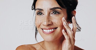 Buy stock photo Skincare, smile and touching with happy woman in studio for cosmetic or dermatology inspiration. Beauty, ideas and satisfaction with mature model isolated on white background for antiaging aesthetic