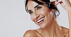 Happy woman, beauty and skincare with jade roller in studio for anti aging on a white background. Female person, model or blood circulation with quartz tool for lymphatic drainage treatment on space