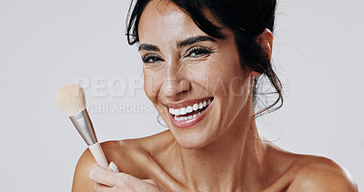 Buy stock photo Woman, makeup brush and smile in studio portrait for beauty, powder and confidence on white background. Mature person, cosmetics and tools for facial foundation, blush and happy in New Zealand